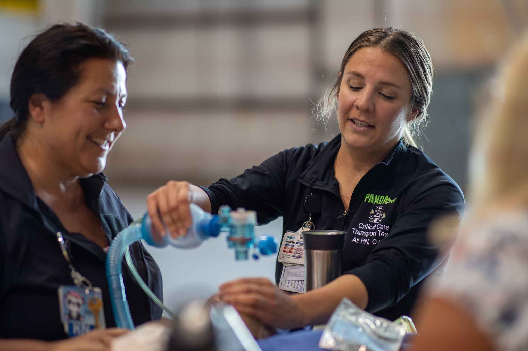 Healthcare professionals demonstrating medical equipment